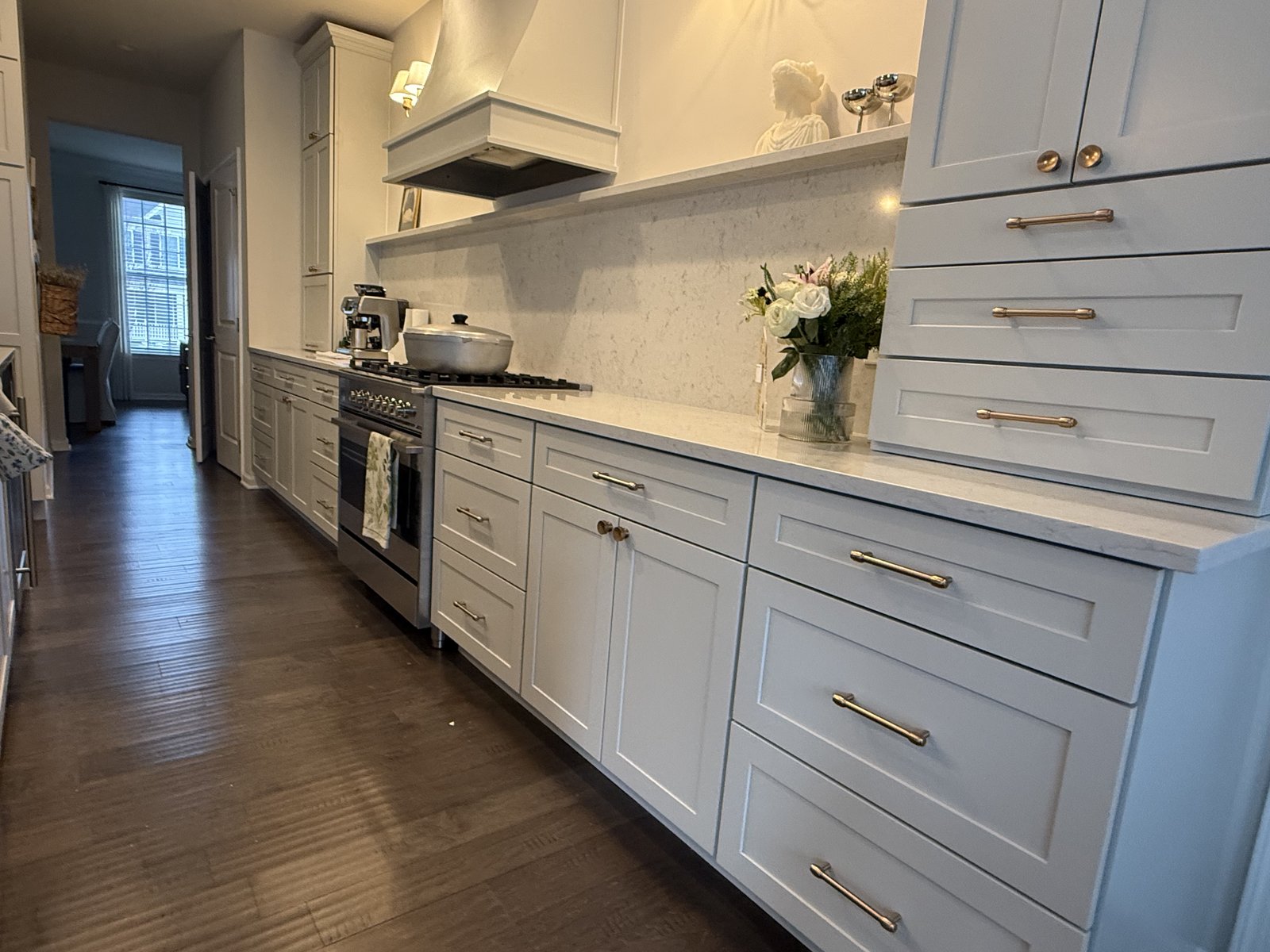 Kitchen cabinetry detail with brass hardware